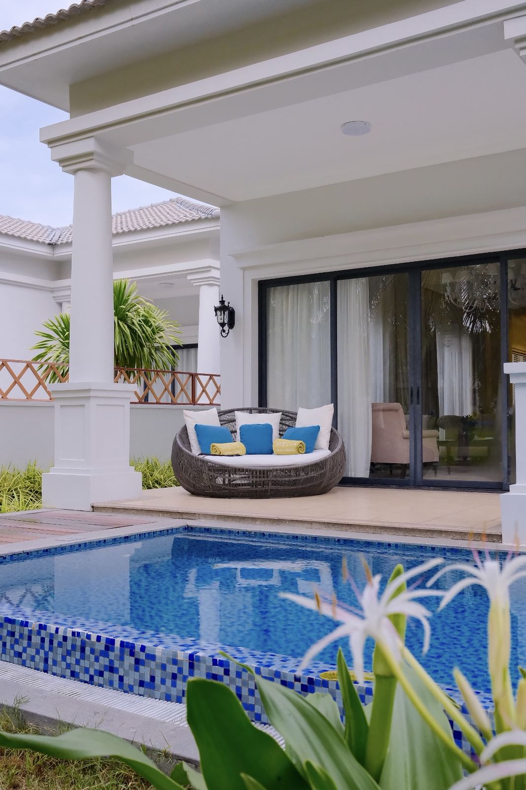 Private pool villa with a round daybed under the veranda